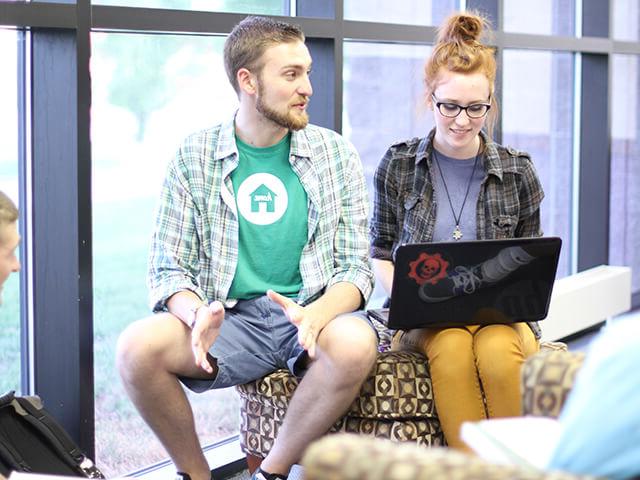 SBU students working on laptop